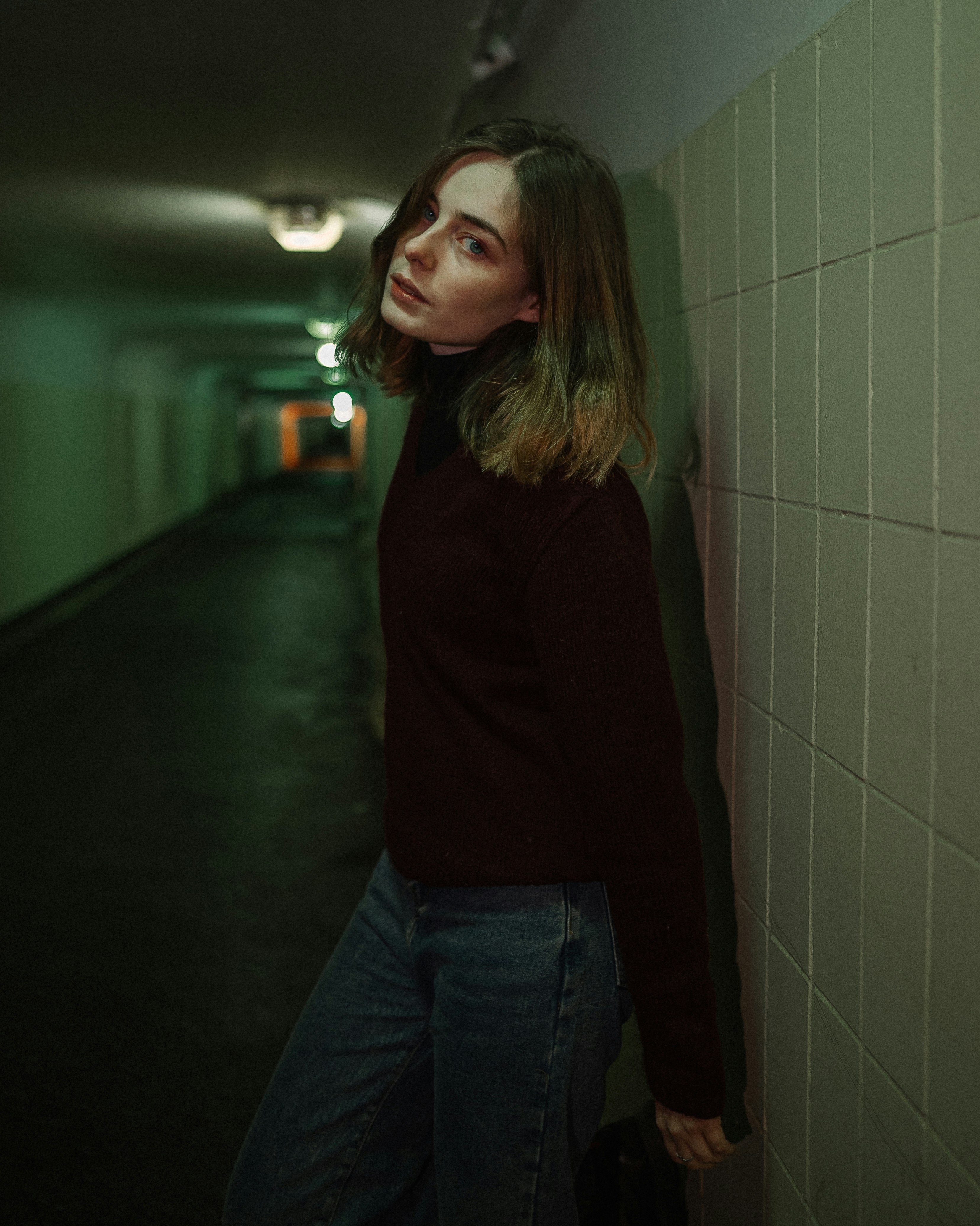 woman in brown long sleeve shirt and blue denim jeans